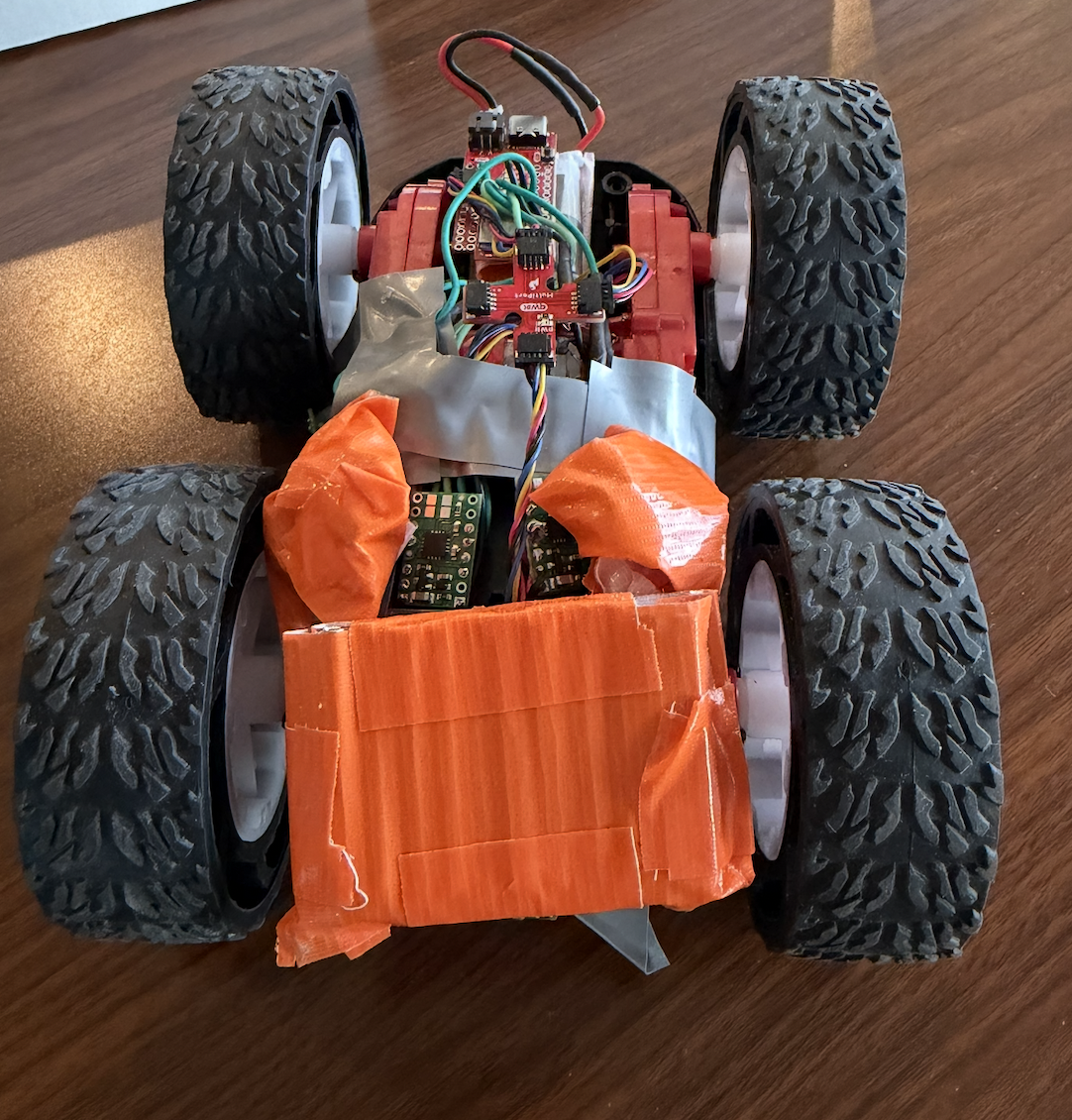 Metal screws taped to front of robot for weight
